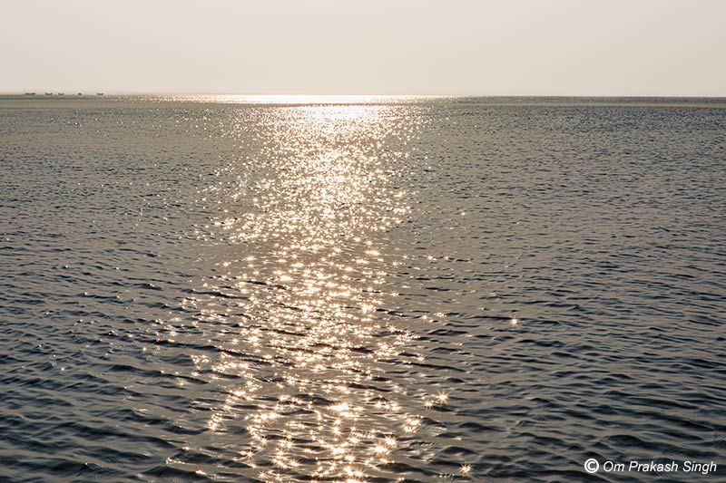The beautiful glittering waterscape of Hooghly River for improving mental health - at Diamond Harbor, South 24 Parganas district, West Bengal